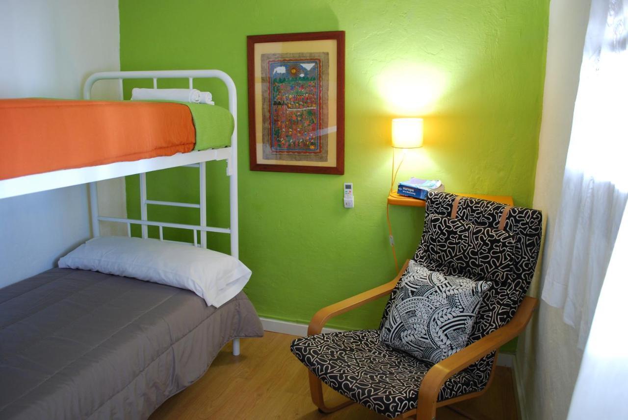 Cama individual en dormitorio compartido mixto de 2 camas