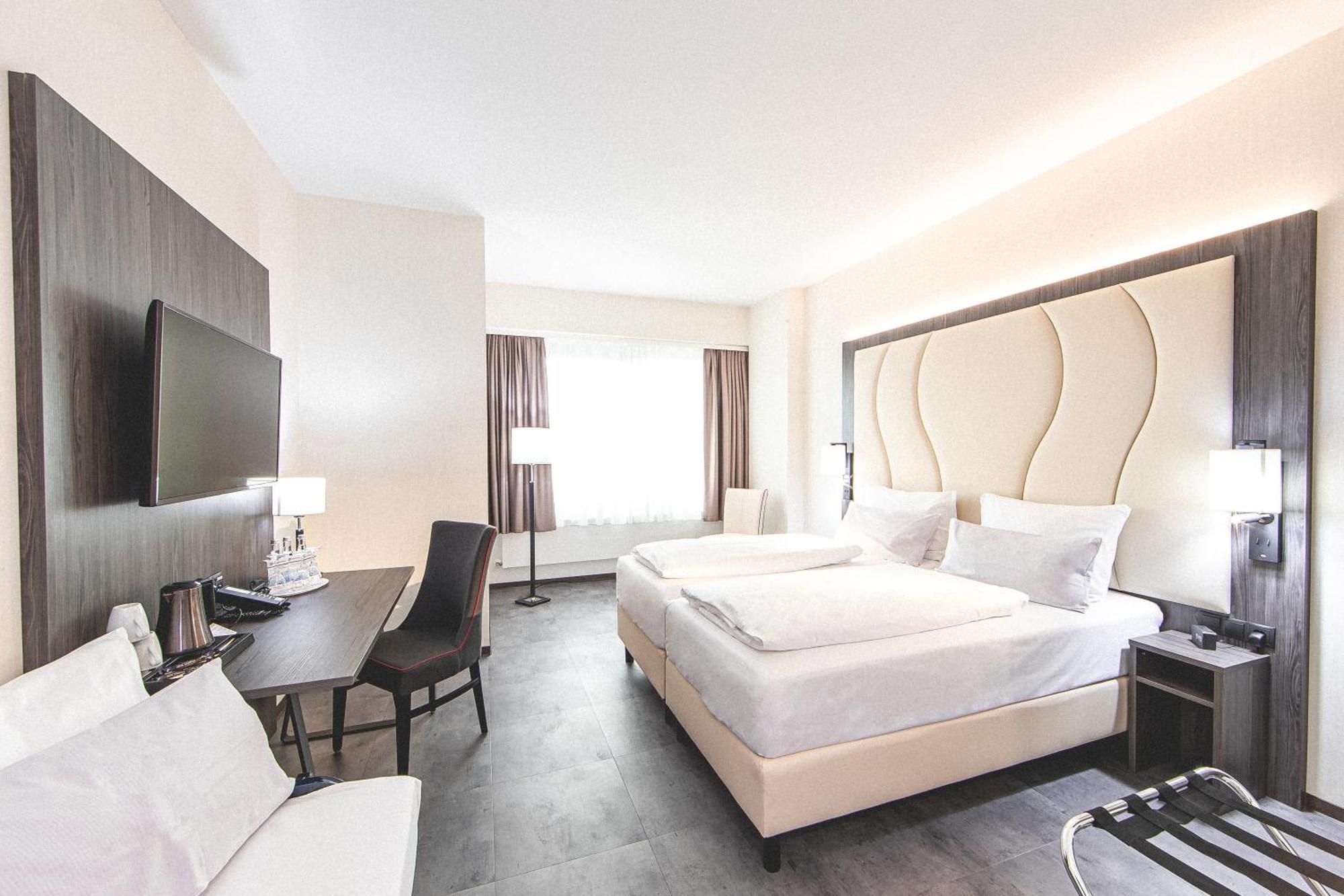 Deluxe Vierpersoonskamer met 1 Tweepersoonsbed en 2 Eenpersoonsbedden