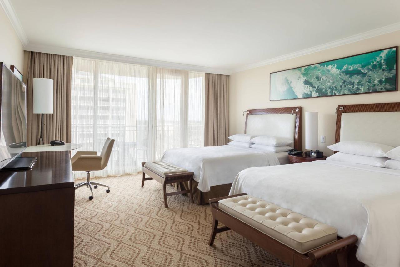 Queen Room with Two Queen Beds with Balcony and Partial Pool/Gulf View