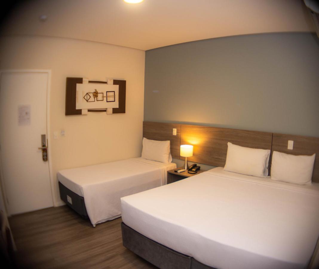 Quarto Triplo Executivo