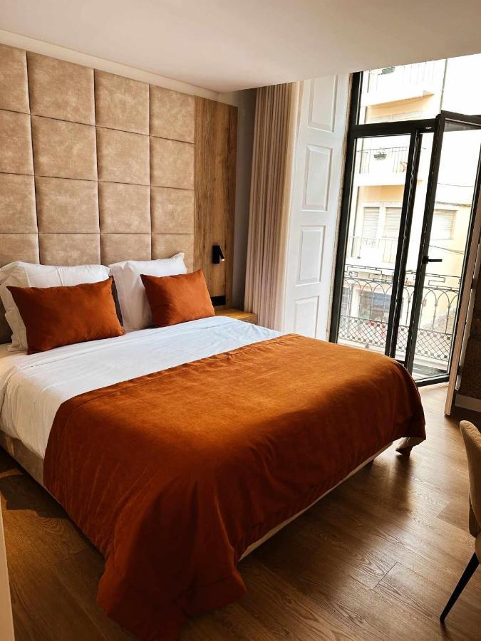 Quarto Duplo com Varanda (2 Adultos + 1 Criança)