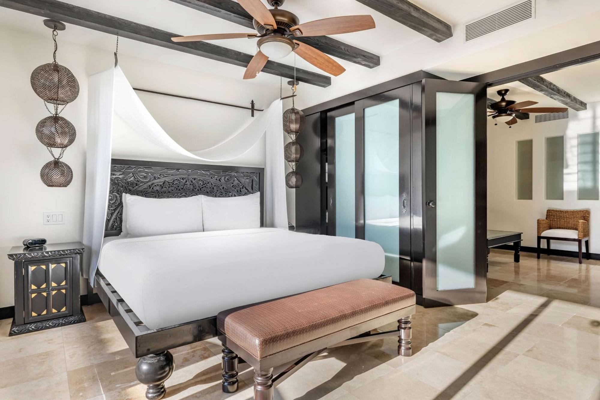 Junior King Suite with Partial Pool View and Balcony