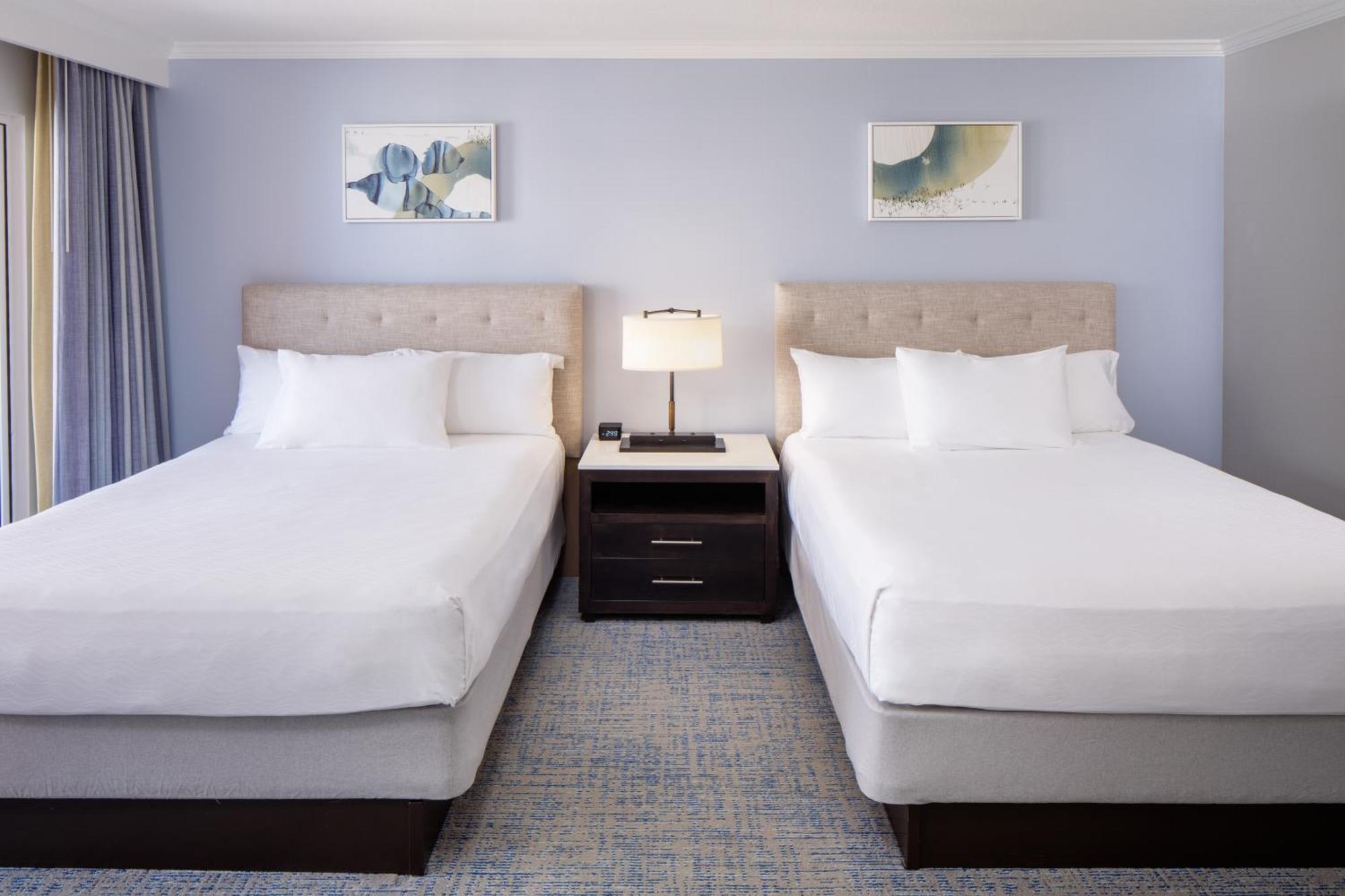 Deluxe Queen Room with Two Queen Beds with Kitchenette and Partial Ocean View