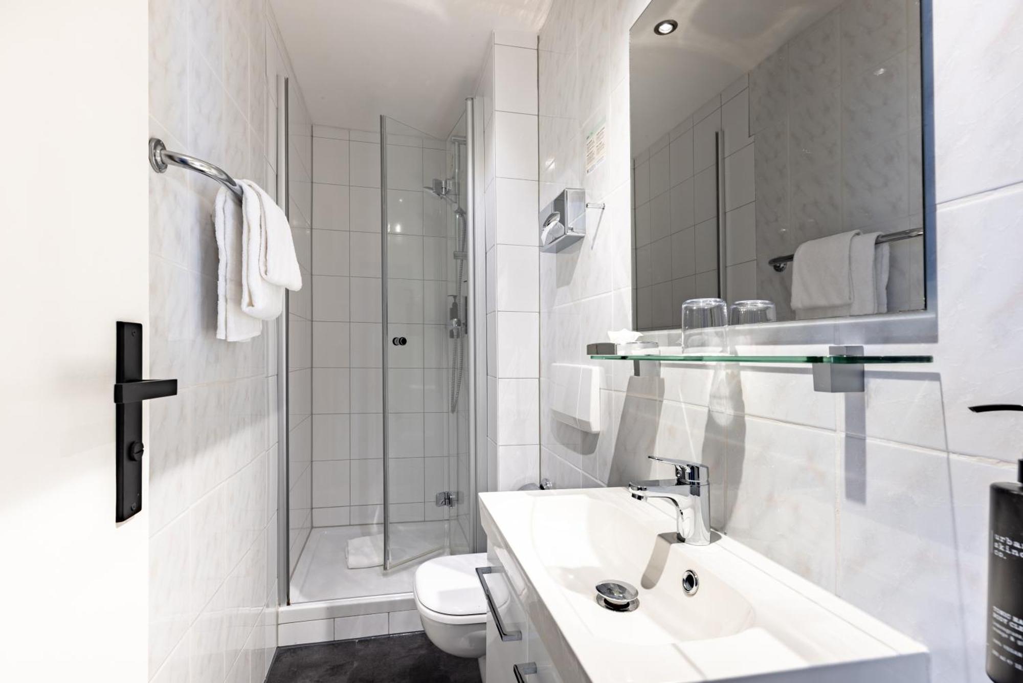 Standaard Kamer met 2 eenpersoonsbedden en een slaapbank