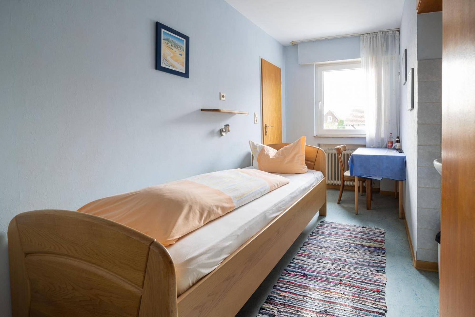 Eenpersoonskamer met Gedeelde Badkamer en Toilet