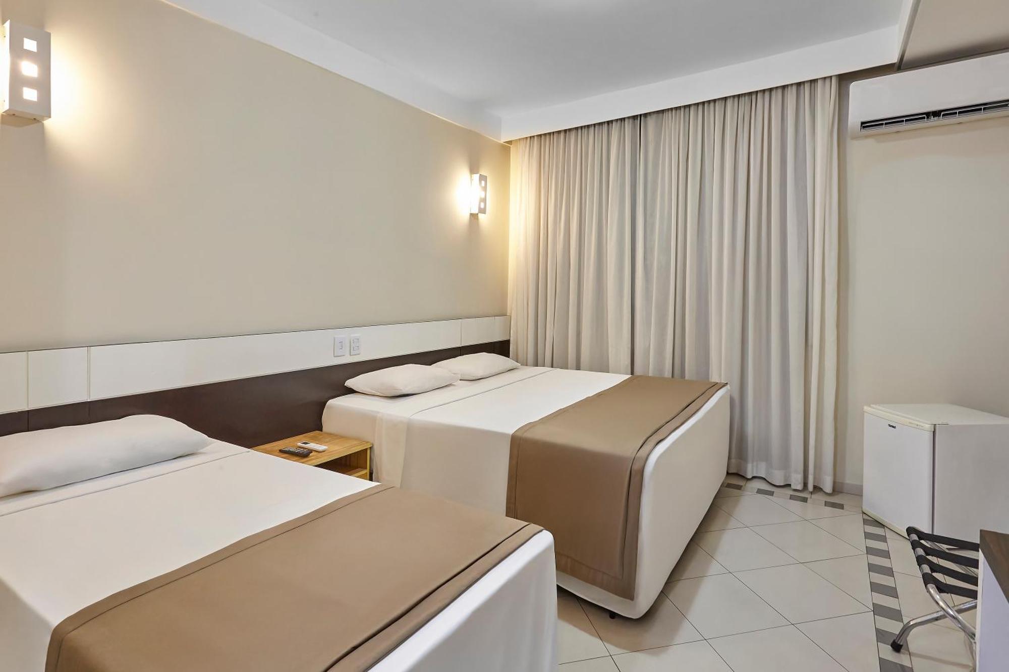 Quarto Triplo Executivo