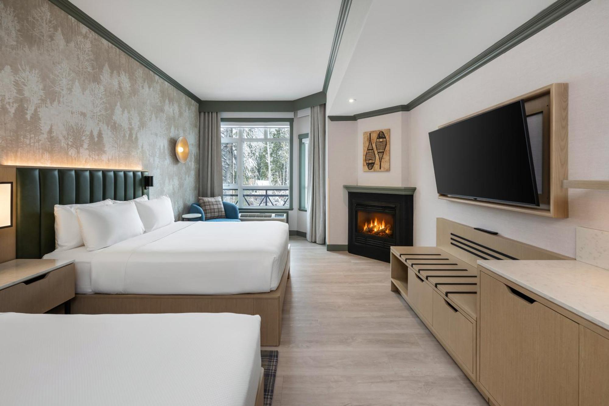 Premier Kamer met 2 Queensize Bedden en Open Haard