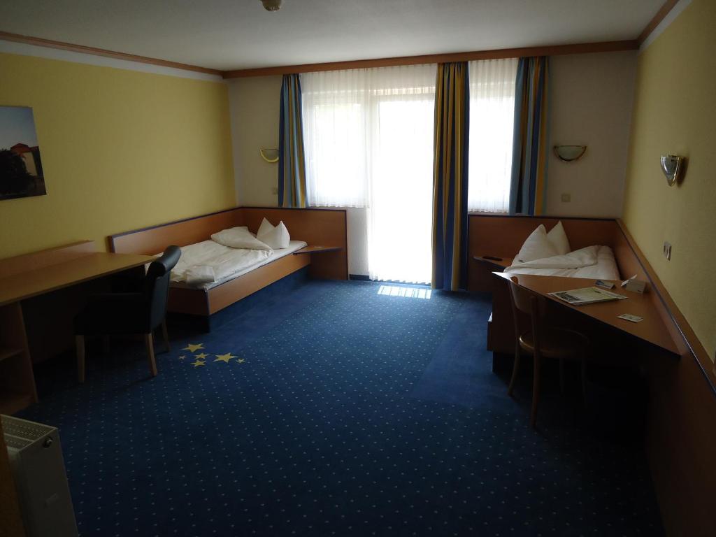 Doppel- oder Zweibettzimmer