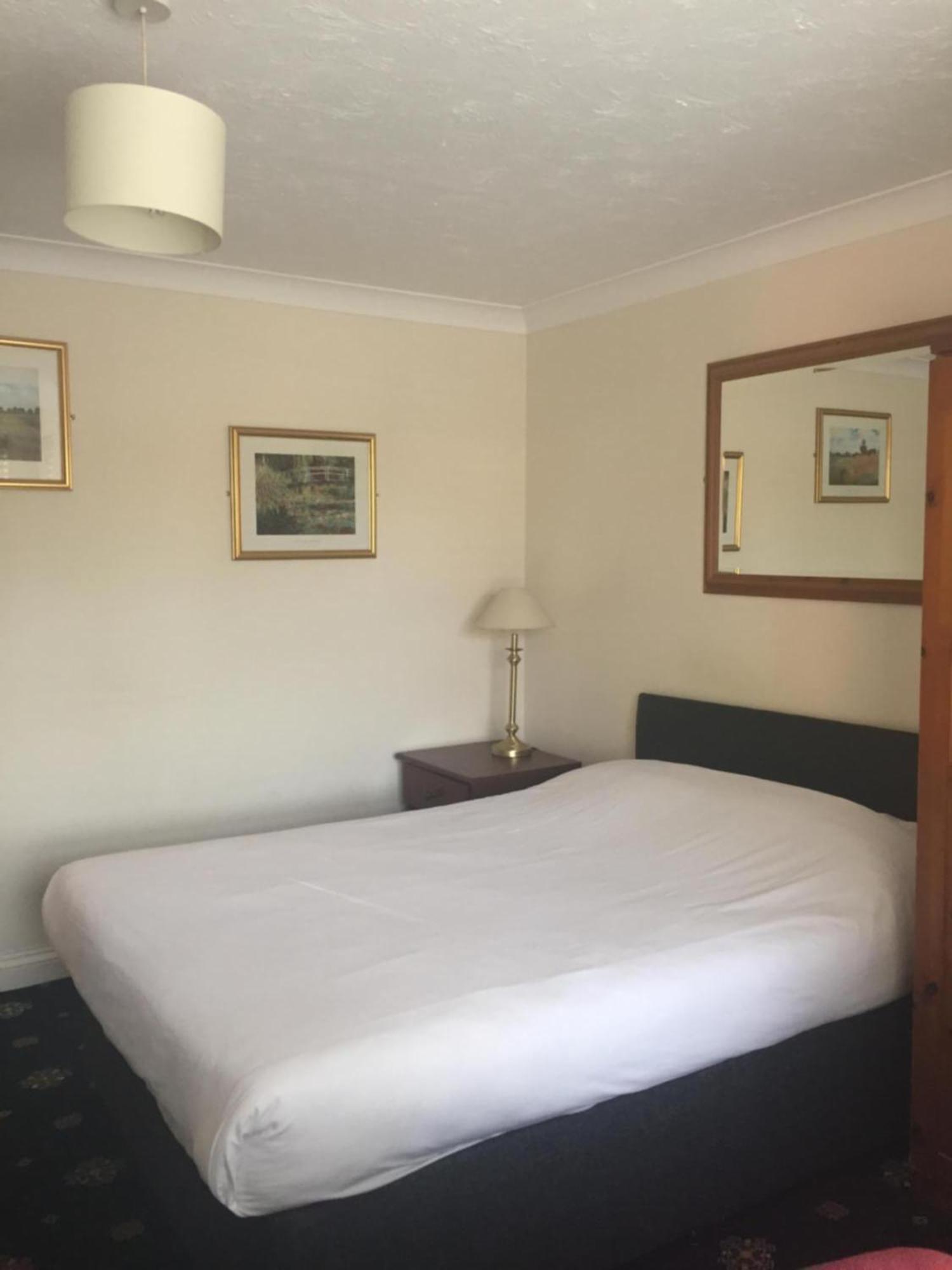 Economy room with double bed and internal window to corridor