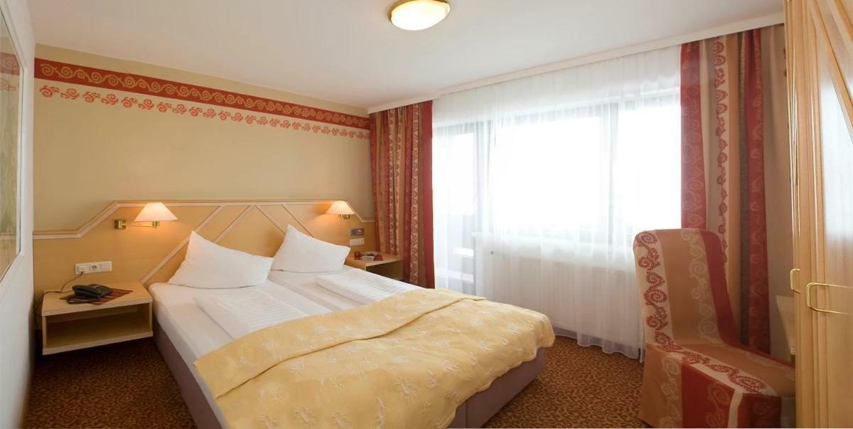 Dreibettzimmer mit Balkon